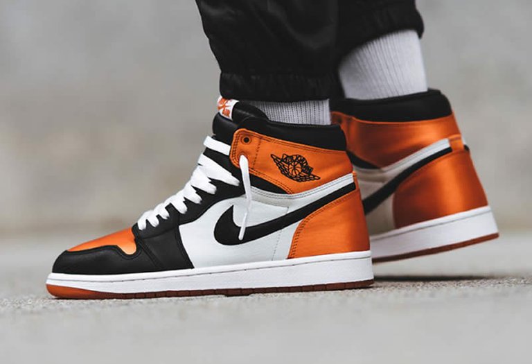 air-jordan-1-retro-satin-orange-shattered-backboard-for-sale-on-feet-(1).jpg