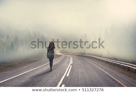 girl-walking-alone-on-mountain-450w-511327276.jpg