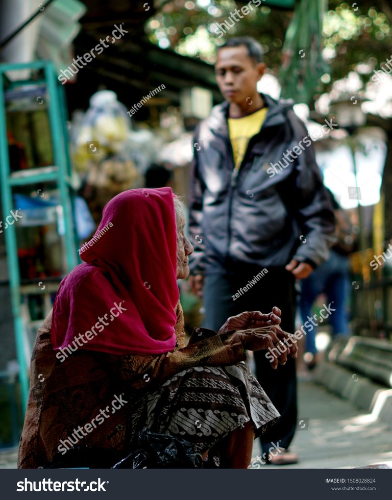 stock-photo-an-old-woman-is-selling-flip-flops-taman-pasty-yogyakarta-indonesia-september-1508028824.jpg