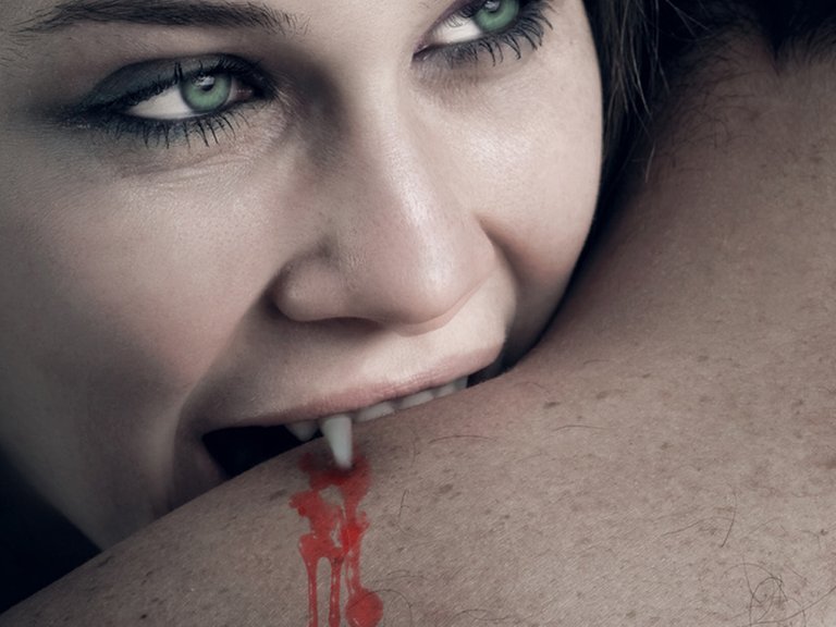 love_and_blood_-_vampire_woman_biting_her_lover.jpg