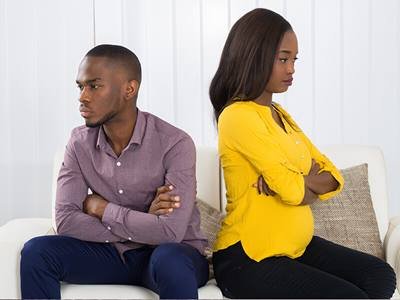 couple-unhappy-fight-divorce-marriage-couch-back_credit-shutterstock.jpg