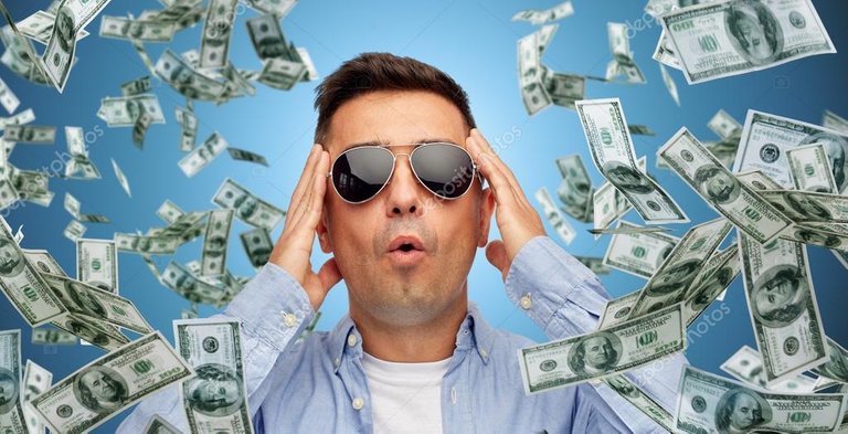 depositphotos_84481626-stock-photo-surprised-man-under-dollar-money.jpg