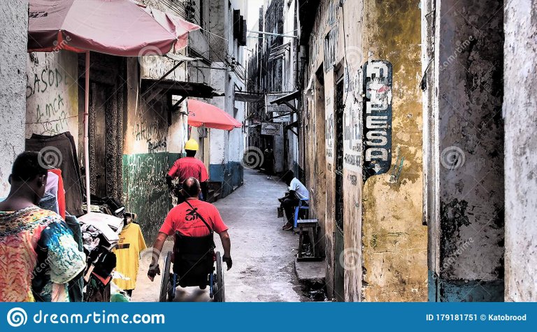 person-wheelchair-moving-narrow-streets-lamu-island-person-wheelchair-moving-narrow-streets-lamu-island-kenya-179181751.jpg