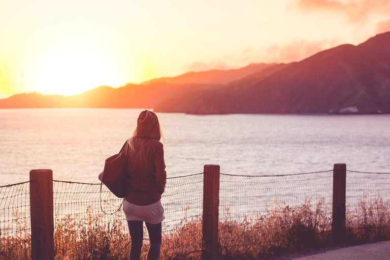 young-girl-on-a-walk-near-the-shore-at-sunset-2_free_stock_photos_picjumbo_hnck2770-2210x1474.jpg