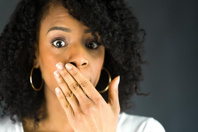 woman-covering-her-mouth-with-one-hand.jpg