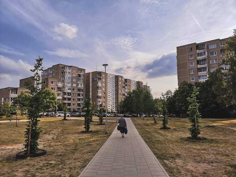 Woman walking home after shopping in Fabijoniškės, VIlnius