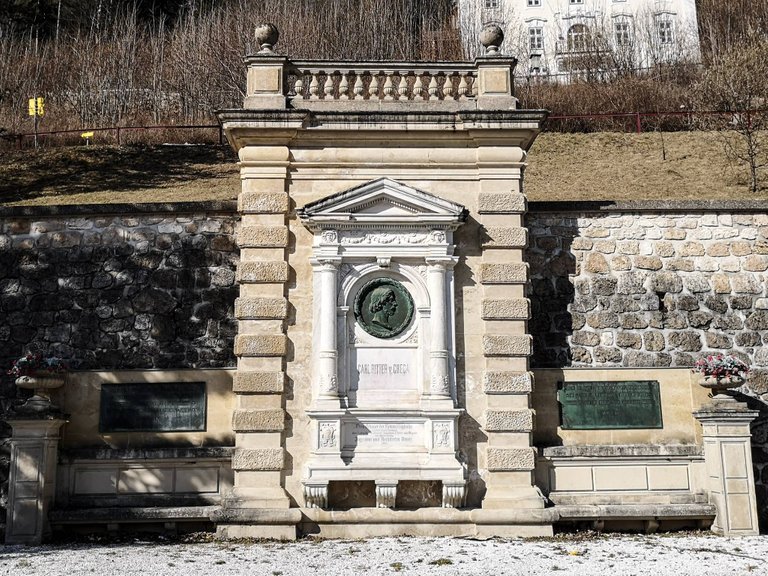   The monument is situated directly at the side of the station building; it was dedicated to Carl Ritter von Ghega – the author of Semmering Railway. Photo by Alis Monte [CC BY-SA 4.0], via Connecting the Dots