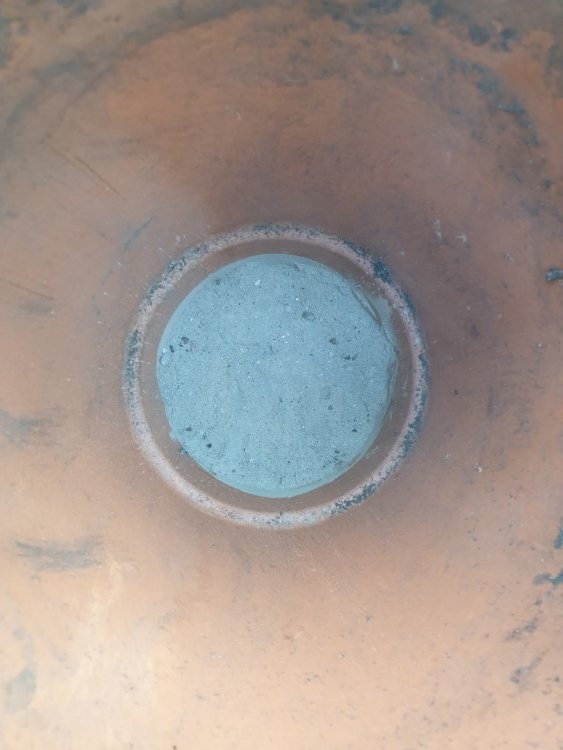 sealing the bottom of a clay watering pot