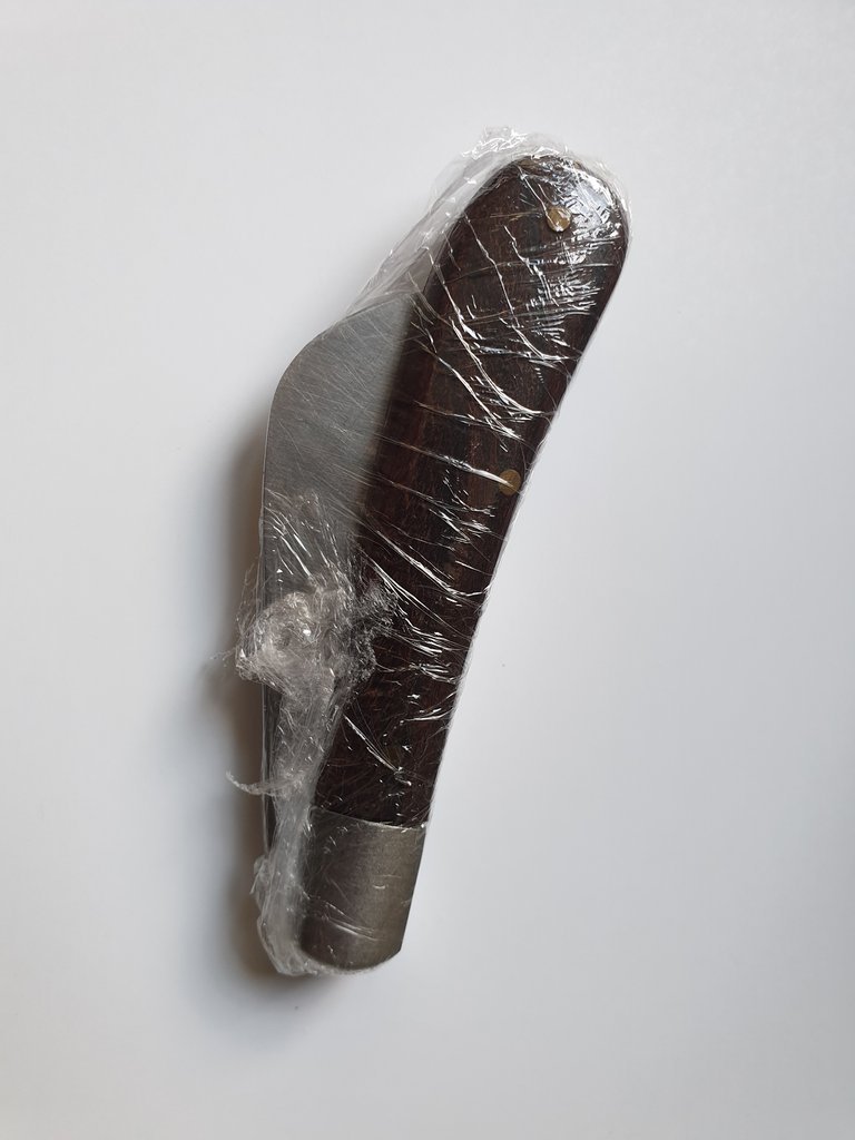 knife covered in cling film