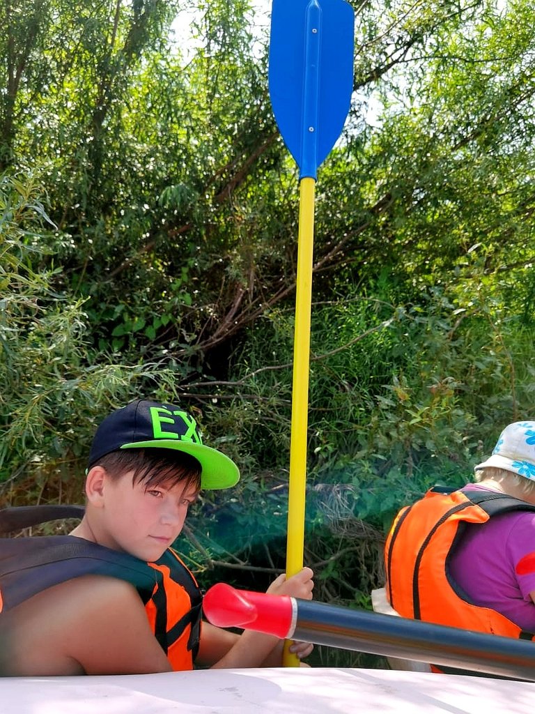 А boy with a paddle:)))