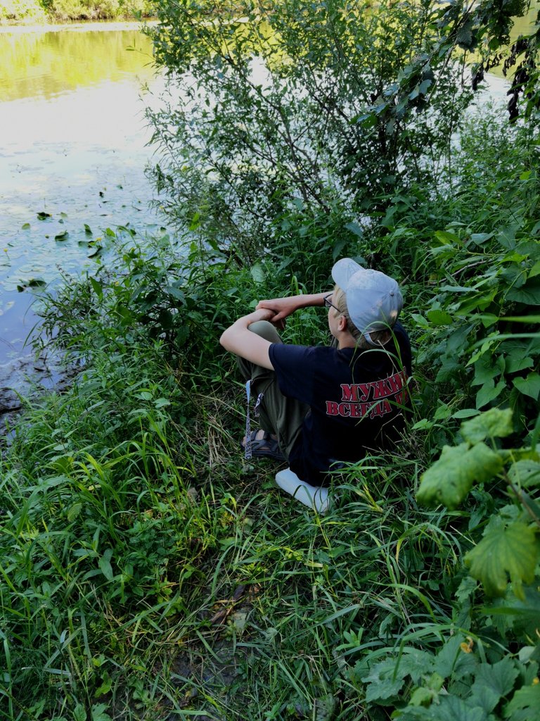 Vanya looks at the river.