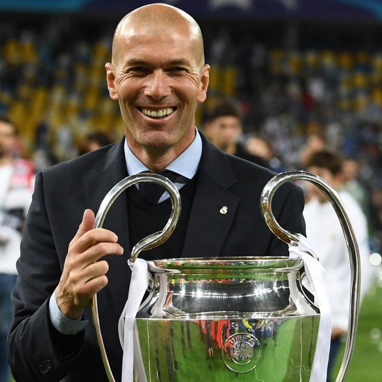 210423182226-topshot-real-madrids-french-coach-zinedine-zidane-holds-the-trophy-as-he-celebrates-winning-the-uefa-champions-league-final-football-match-between-liverpool-full-169.jpg_423682103.jpg