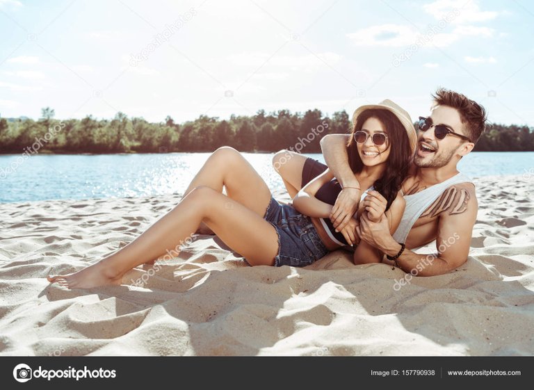 depositphotos_157790938-stock-photo-couple-resting-on-beach.jpg