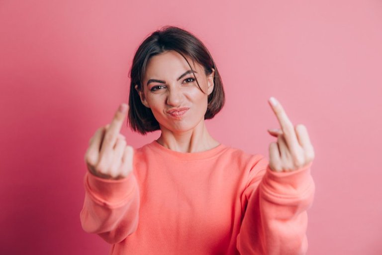 woman-wearing-casual-sweater-on-background-showing-middle-finger-doing-bad-expression-provocation-and-rude-attitude.jpg