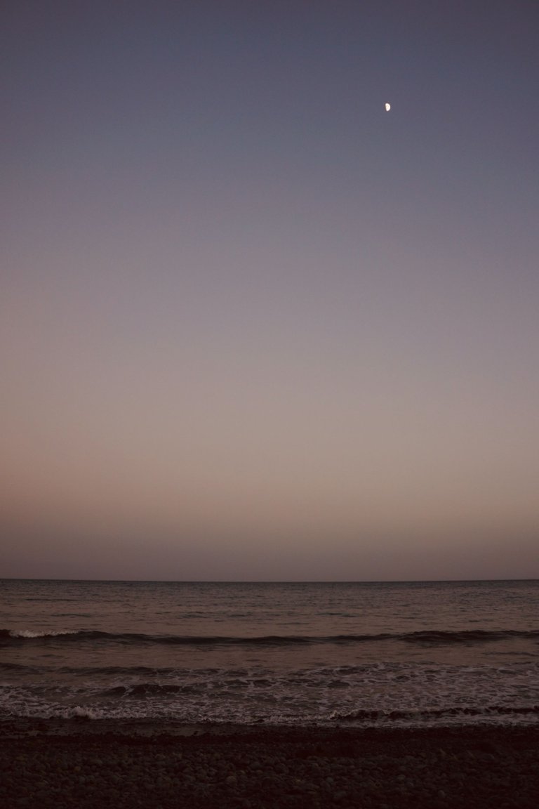 Half moon over the Atlantic Ocean after sunset