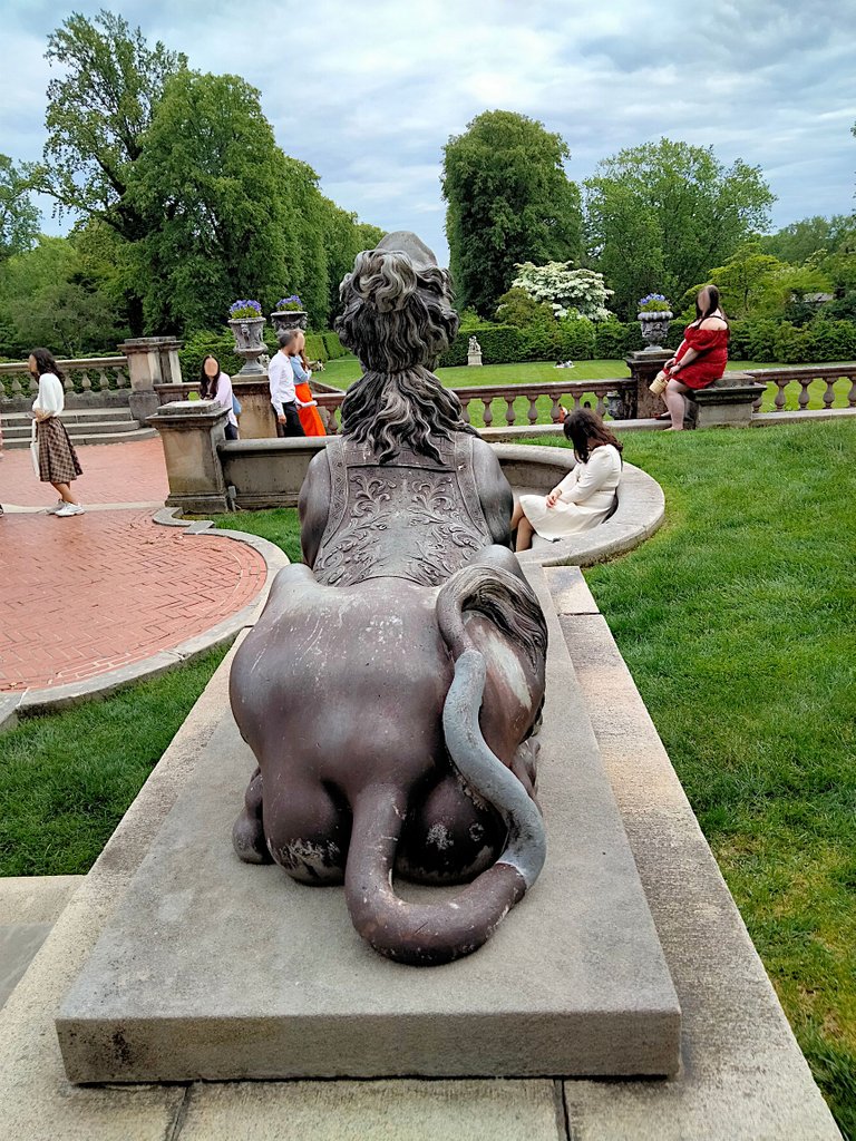 female statue overlooking the grounds.png