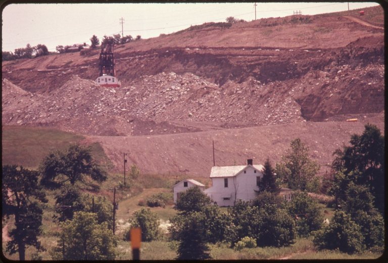 COAL_SHOVEL_AND_STRIP_MINING_FORM_THE_BACKDROP_OF_THIS_HOUSE_AT_THE_INTERSECTION_OF_INTERSTATE_70_AND_ROUTE_^800_NEAR..._-_NARA_-_555604.jpg