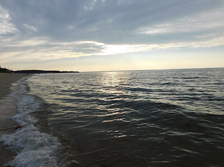 waves hitting shore center island.png