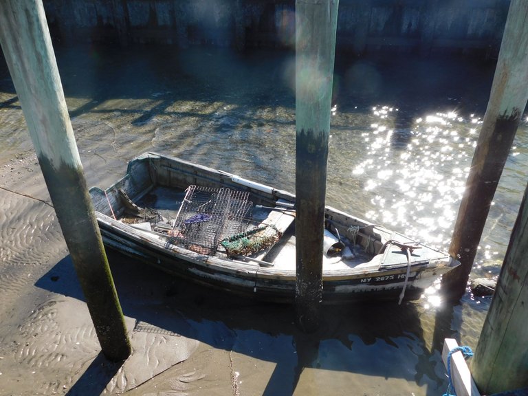 small fishing boat tied at pier northport.jpg