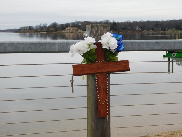 flower memorial on a pier oyster bay.png