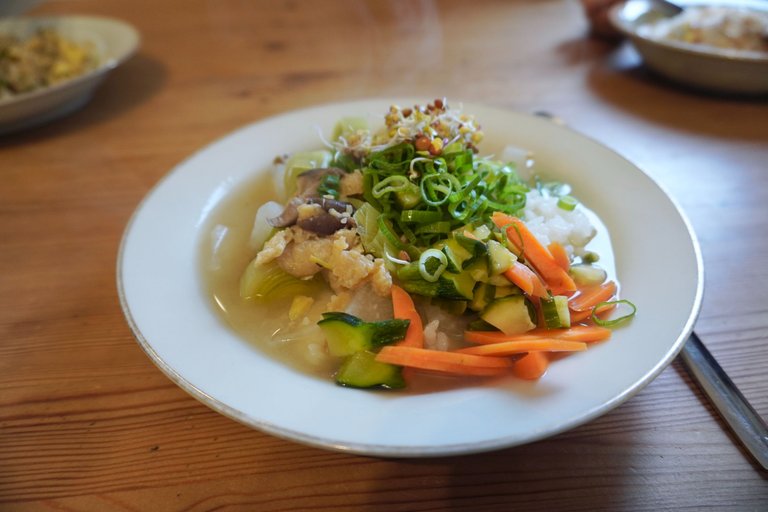 Miso soup, rice, pickles, and microgreens