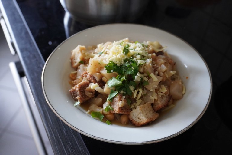 Bread porridge topped with non-melting, non-stretchy vegan cheese.