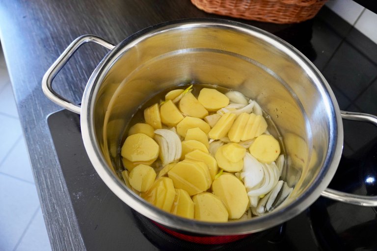 Cooking the onions and potatoes