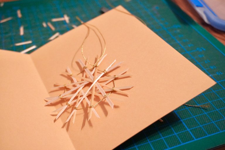 Cards decorated with straw stars for a family gathering