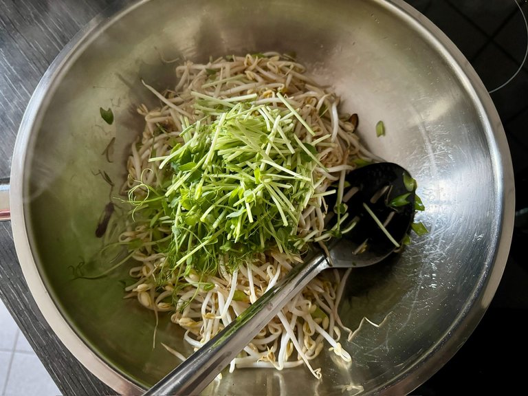 Pea shoots in wok