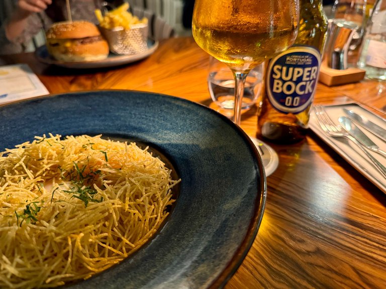 Delicious grilled cod meal with non-alcoholic Super Bock