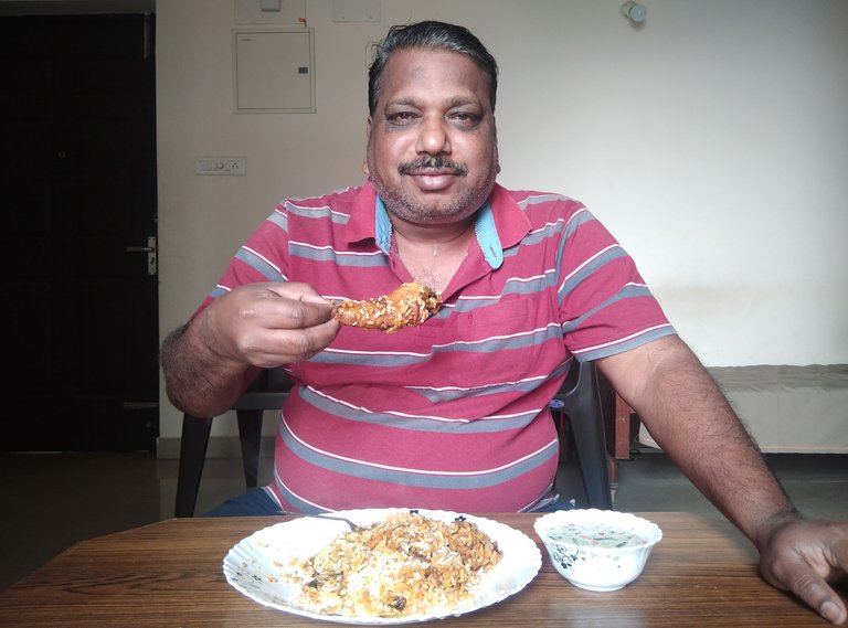 Enjoying  Biriyani.jpg