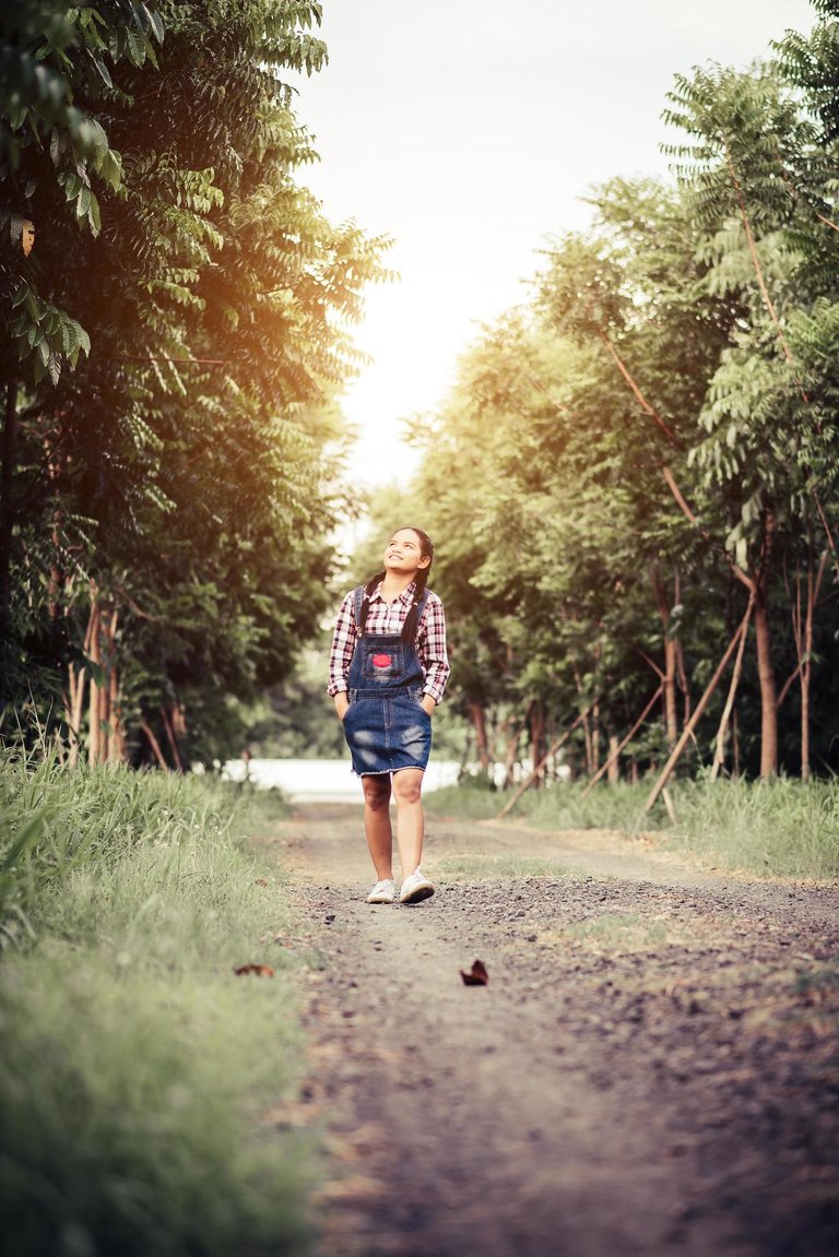 young-happy-girl-walking-in-a-forest-in-the-summer-free-photo (1).jpg