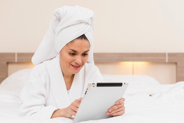 woman-using-tablet-hotel-room_23-2148095284.jpg