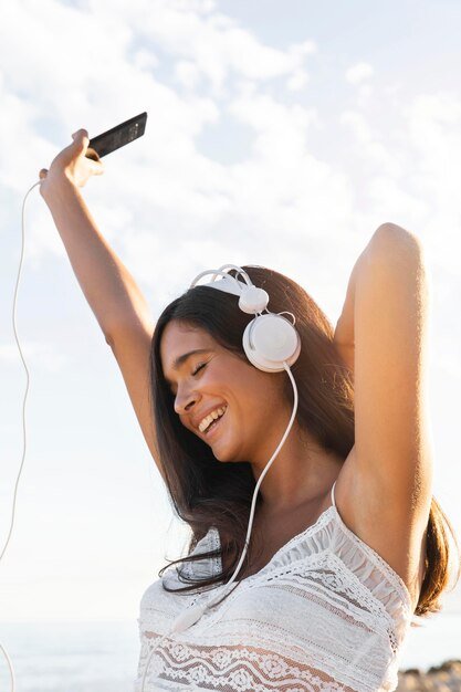 happy-girl-with-headphones-outdoors_23-2148678413.jpg