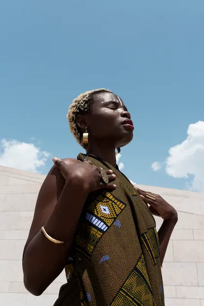 portrait-woman-posing-traditional-african-attire-outdoors_23-2150572667.webp