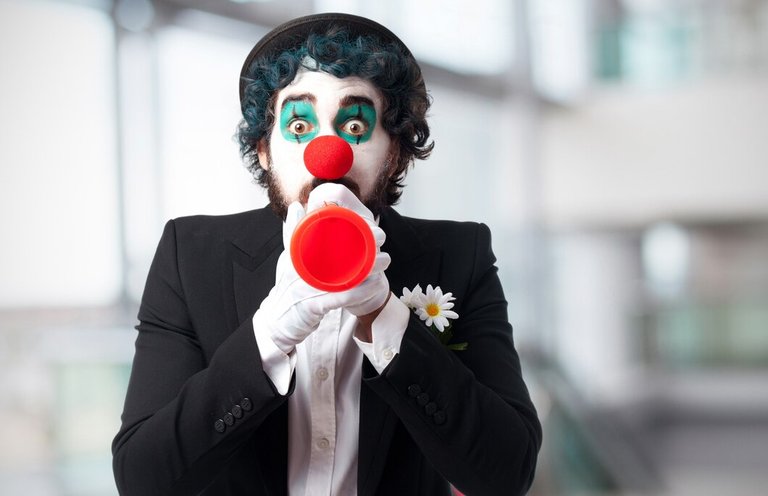 clown-with-toy-trumpet_1154-80.jpg
