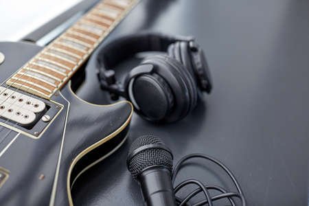 163138867-close-up-of-bass-guitar-microphone-and-headphones.jpg