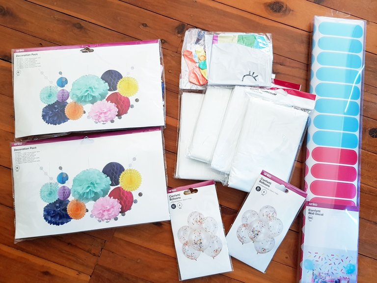 Paper decoration pack, balloons, table cloths, confetti stickers.