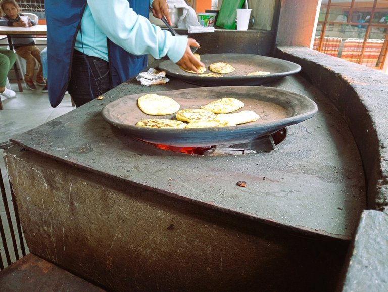 Tortillas de Tiesto. 25cents each. A colada is 0,50cents, so Lily usually gets two tortillas and one colada, and that's enough to keep her busy and happy while I do my shopping. The women that prepare the tortillas already know us, so I can just leave Lily there, and they keep an eye on her.