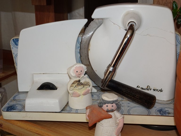 I remember investing in my first slicing machine. My mom brought it from Germany, it was around 120$. Now, we have one worth 1300$. We charge 50cents for slicing, and will never recover the 1300$ - but we gain new clients by offering sliced bread. The "machine" in the picture is from by great-grandmother, a piece of heritage from my mom.