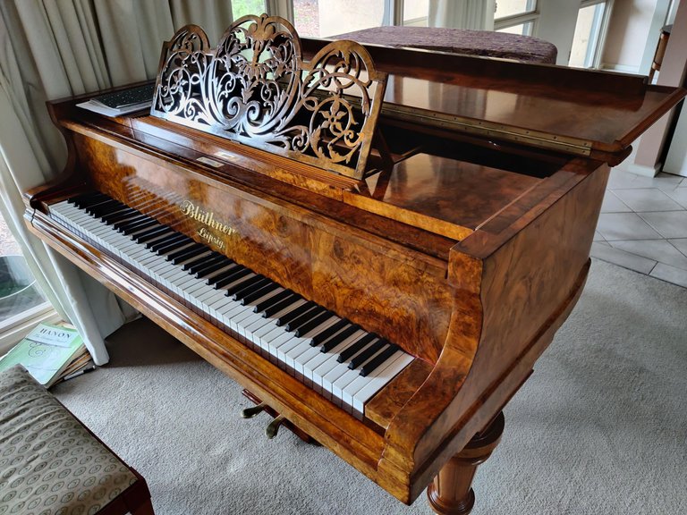 Repairing an ornate wooden music stand.jpg