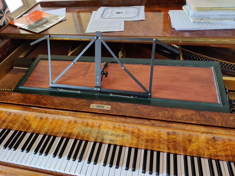 Repairing an ornate wooden music stand.jpg