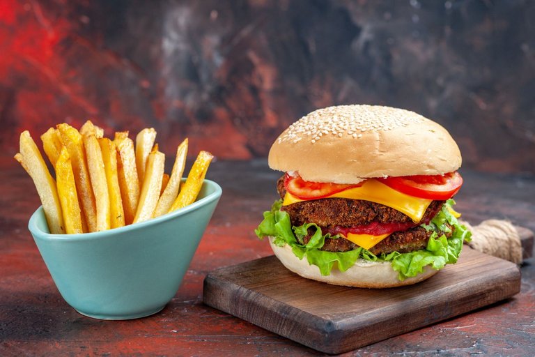 front-view-tasty-meat-burger-with-french-fries-dark-background.jpg