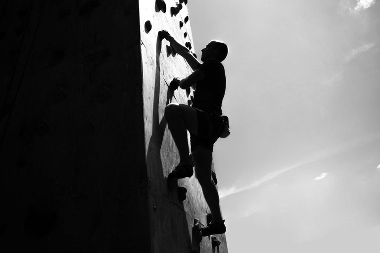 young-man-exercising-indoor-climbing-gym.jpg