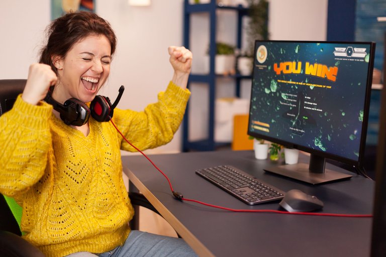 joyful-player-celebrates-victory-winning-space-shooter-online-video-game-powerful-personal-computer.jpg