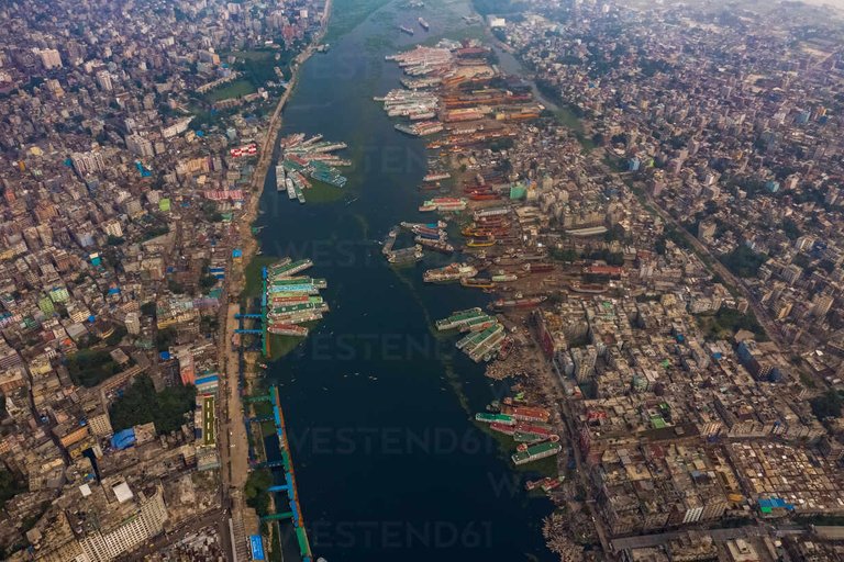 aerial-view-of-dhaka-skyline-city-centre-along-buriganga-river-with-gol-talab-artificial-lake-in-foreground-dhaka-bangladesh-AAEF10537.jpeg
