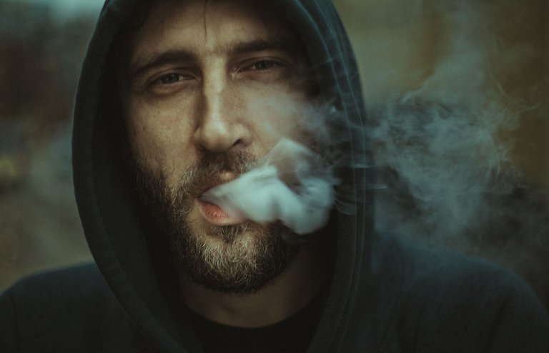 Smoking man in a hoodie.jpeg