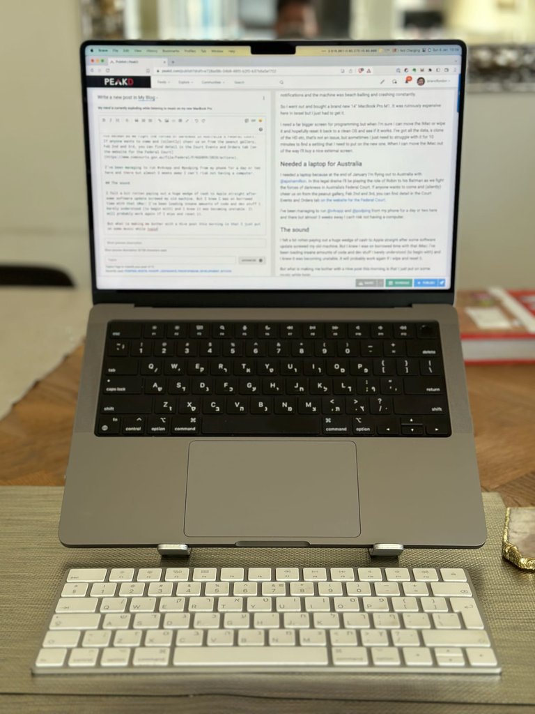 macbook pro on a stand