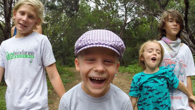 Ocean, smiling, brings lots of laughs to the school group.