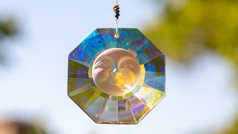 This suncatcher casts rainbows all around—an interplay between sun and stone.